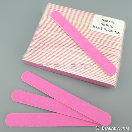white disposable wooden nail file